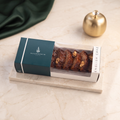 Box of English date cake with sauce